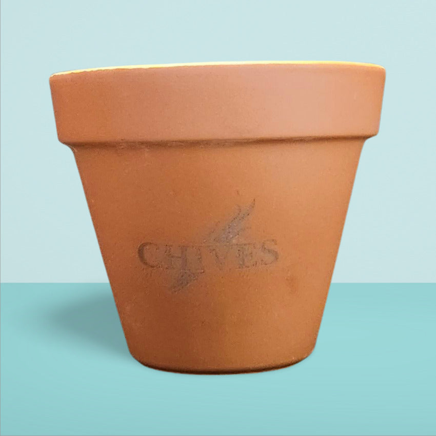 Custom terra cotta flowerpot chives engraving by Artisan Branding Company.