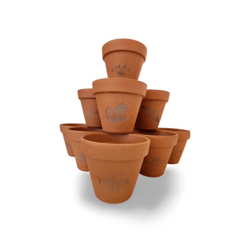 Custom terra cotta flowerpot herb engraved collection by Artisan Branding Company.