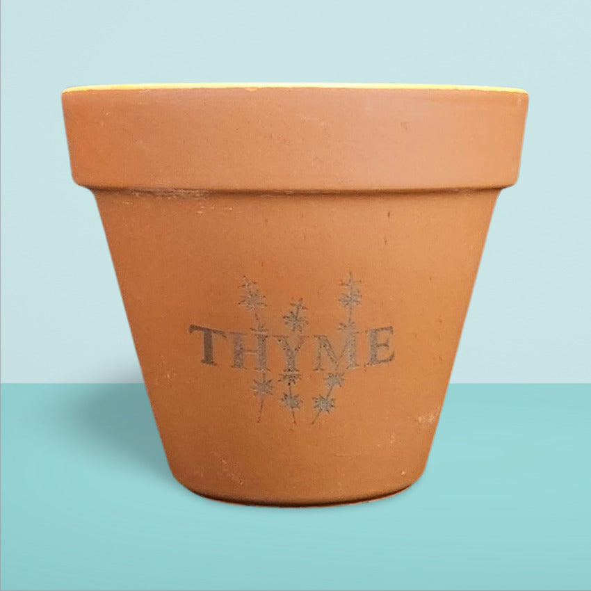 Custom terra cotta flowerpot thyme engraving by Artisan Branding Company.