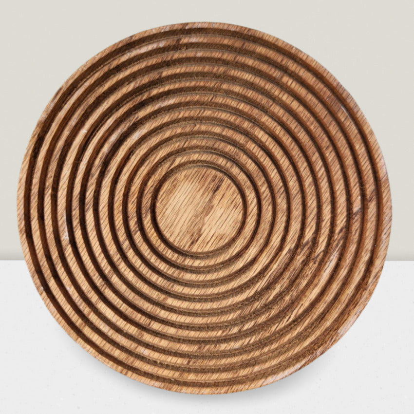 Round custom made wood trivet with grooves by Artisan Branding Company.